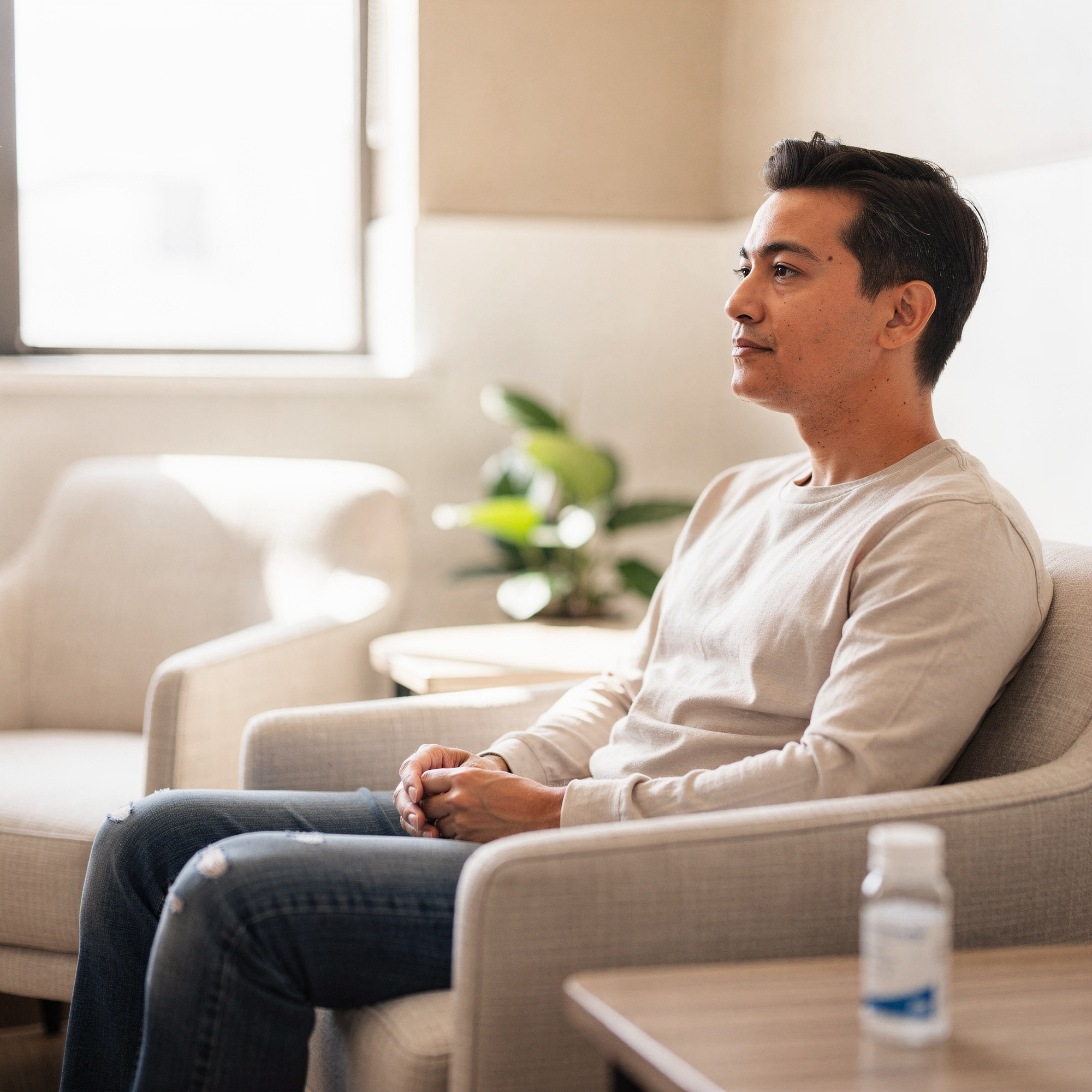 Patient seated in a comfortable chair during a Spravato treatment consultation